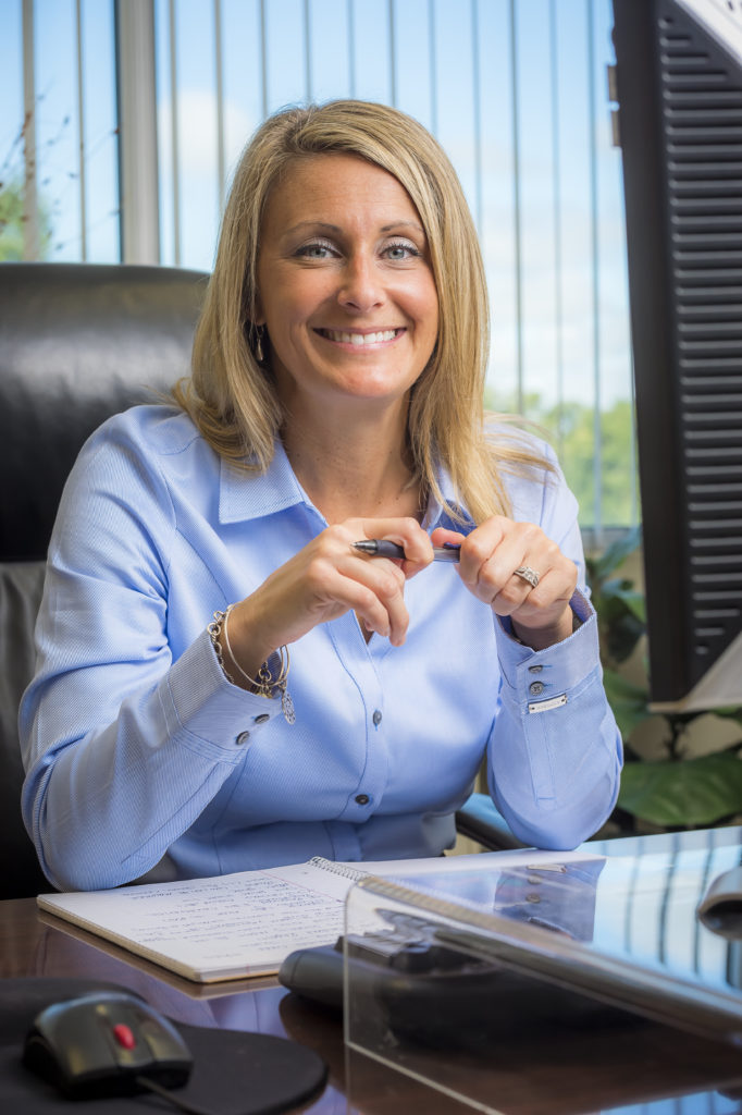 Jennifer Hodges Lytch, marketing representative/customer service management for The Andersons. Lytch holds some of the fertilizer their company produces. October 6, 2015 in Maitland, Florida, photo by Roberto Gonzalez
